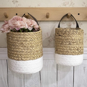 Set of 2 woven seagrass wall hanging baskets with leather straps for plant storage