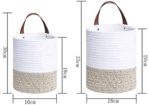 Detail view of woven wall hanging baskets with leather handles and size dimensions