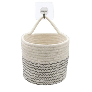 Hanging woven cotton rope planter basket in cream and black chevron pattern