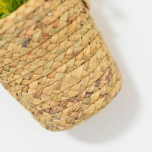 Close-up of seagrass woven basket texture featuring natural beige and brown fibers