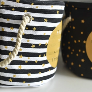 Detail of heavy canvas storage bin with stripe pattern and cotton rope handle