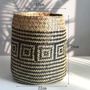 Detail of woven seagrass basket with black diamond pattern and size dimensions