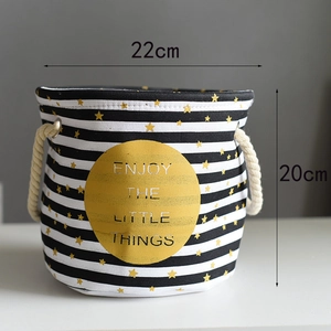 Detail view of striped linen storage basket with yellow print and rope handles, 22cm x 20cm