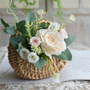 Handwoven wicker flower basket with elegant artificial roses for home decor