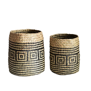 Set of two handmade woven seagrass storage baskets with black diamond geometric patterns