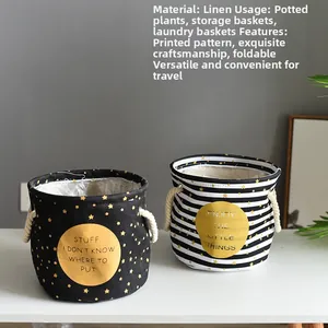 Close-up of foldable linen planter bags with rope handles and golden star patterns