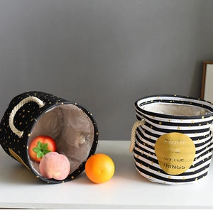 Detail of fabric storage baskets with star prints, hemp rope handles and waterproof lining