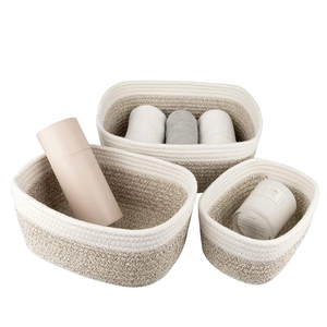 Detailed close-up of three-piece cotton rope woven baskets with dual-tone texture