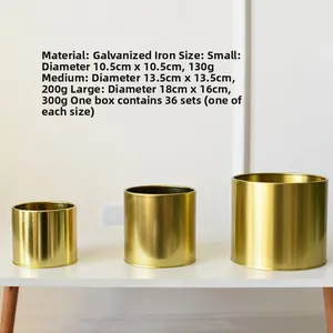 Set of three gold plated iron flower pots in small, medium, and large sizes