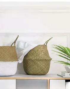 Detailed texture of hand-woven seagrass basket with double handles and dual-tone finish