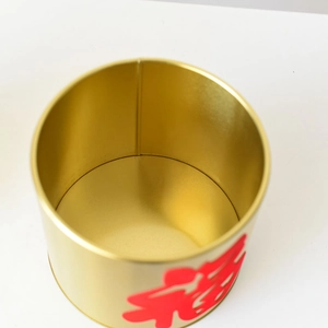 Macro top view of gold cylindrical metal bucket with a red Chinese Fu character