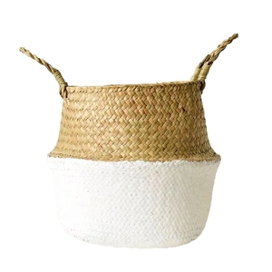 Handwoven seagrass belly basket in natural and white dual-tone finish with handles