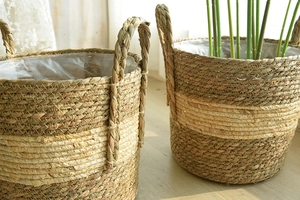 Detailed close-up of woven seagrass basket with striped pattern and clear plastic liner