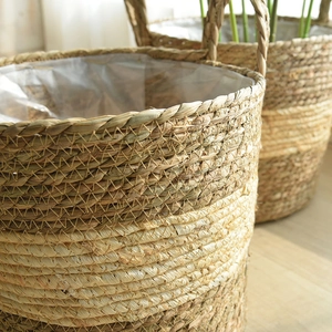 Handwoven seagrass plant basket with dual-tone texture and waterproof lining for home decor