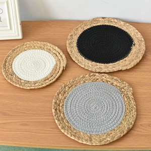 Three-piece heat-resistant woven trivet set in black, white, and grey cotton rope