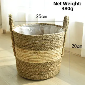 Detail of hand-woven straw plant pot with waterproof lining and dual handles