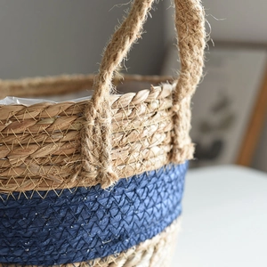 Detail showing the thick hemp rope handle and seagrass weave with waterproof liner