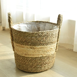 Handwoven seagrass plant basket with sturdy handles and waterproof plastic liner