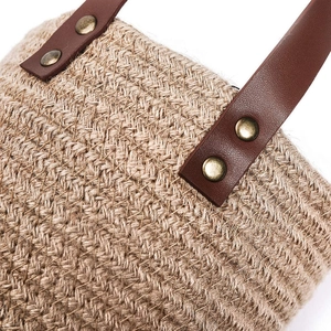 Cotton linen wall hanging basket with brown leather handle and rustic metal rivets