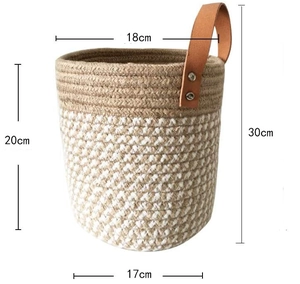 Macro detail of cotton woven hanging basket with brown leather handle and size measurements