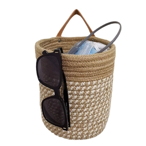 Hanging cotton rope plant basket with brown leather handle in white and jute stripes