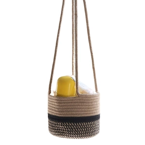 Handmade hemp rope hanging plant basket with black contrast and decorative interior items