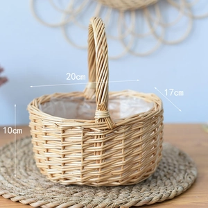 Detail of hand-woven wicker basket with dimensions 20cm by 17cm and plastic lining