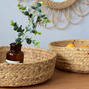 Close-up of hand-woven round seagrass storage trays with natural fiber texture