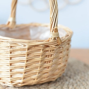 Handwoven willow flower basket with sturdy handle and waterproof lining for home decor