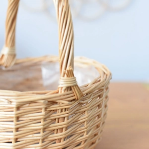 Close-up of hand-woven wicker basket featuring natural textures and plastic liner
