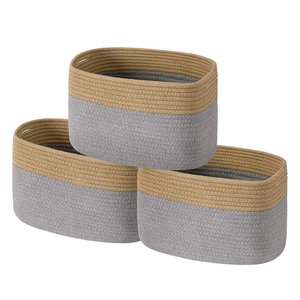 Detailed texture of hand-woven cotton rope storage baskets with built-in handles