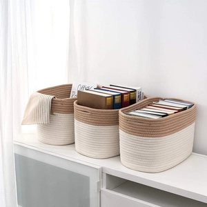 Three-piece set of woven cotton rope storage baskets in cream and brown patchwork design