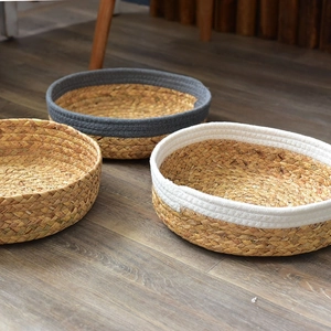 Detailed texture of round woven storage baskets in natural, grey, and white color styles