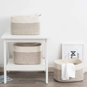 Detailed texture of rectangular cotton rope storage baskets in two-tone woven design