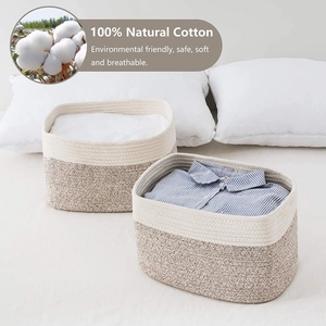 Detail of woven cotton rope storage baskets showing two-tone texture and soft natural fabric