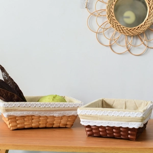 Handwoven rectangular storage baskets with lace lining in natural and coffee brown finishes
