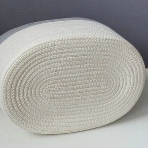 Macro shot of the two-tone cotton rope weaving texture on the bottom of the storage basket