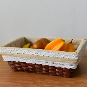 Rectangle wicker basket with linen lining and delicate lace edge for home storage