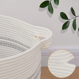 Minimalist woven cotton rope storage basket with gray stripes and reinforced handles