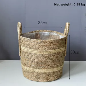 Detail of woven basket with handles, plastic liner and 35cm diameter dimensions
