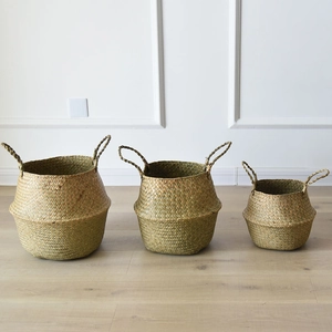Set of three natural seagrass belly baskets in various sizes for home storage