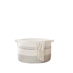 Minimalist cotton rope laundry basket in white with dark gray stripes and dual handles