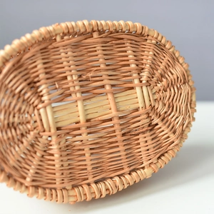 Close-up of natural woven rattan basket showing intricate cross-weave patterns and texture