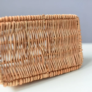 Close-up of tightly woven natural willow texture and artisanal edges on a flower basket