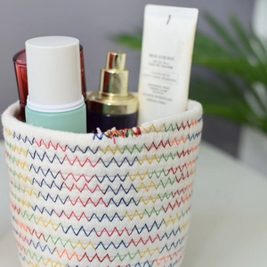 Minimalist rainbow stitched cotton rope storage basket for desktop makeup and accessory organizing
