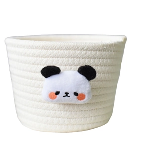 Handwoven white cotton rope storage basket with a cute plush panda accessory decoration