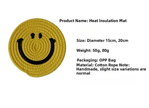 Detailed view of yellow woven cotton rope coaster featuring a black smiley face pattern