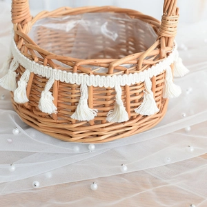 Macro detail of hand-woven wicker flower basket with fringe trim and clear plastic liner