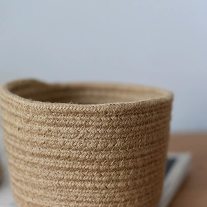 Close-up of thick cotton and jute woven storage basket showing natural fiber texture