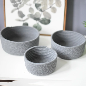 Three-piece set of gray cotton rope woven storage baskets in round minimalist design